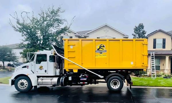 Photo of roll off truck with 30 yard dumpster rental near Austin Texas.